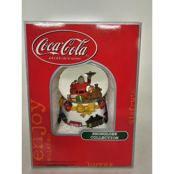 Coca-Cola Snow Globe Santa Sitting Holding Toy Airplane