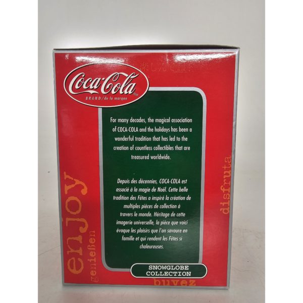 Coca-Cola Snow Globe Santa Sitting Holding Toy Airplane